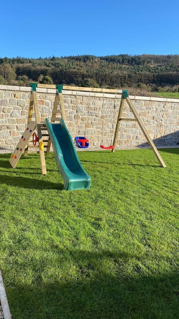 Swing and slide set with rock climb